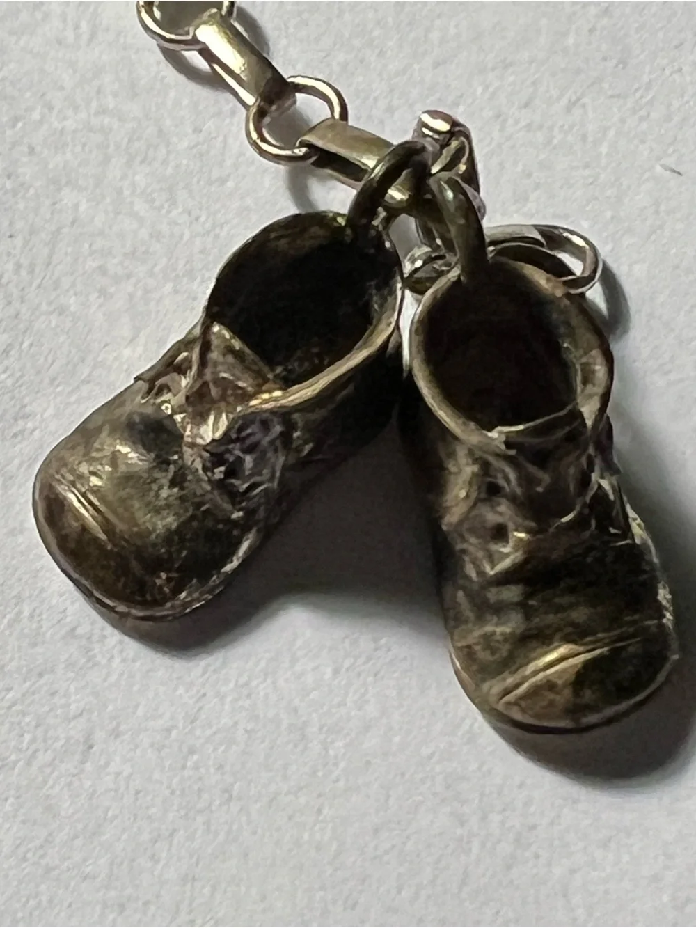 Sterling Silver charm bracelet with silver baby shoes charms